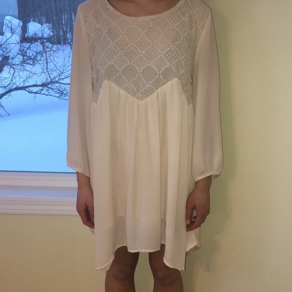 Large, fits like a small, flowy creme dress.